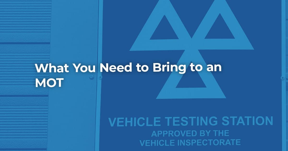 The article title over the outside of an MOT testing centre, in a blue overlay.