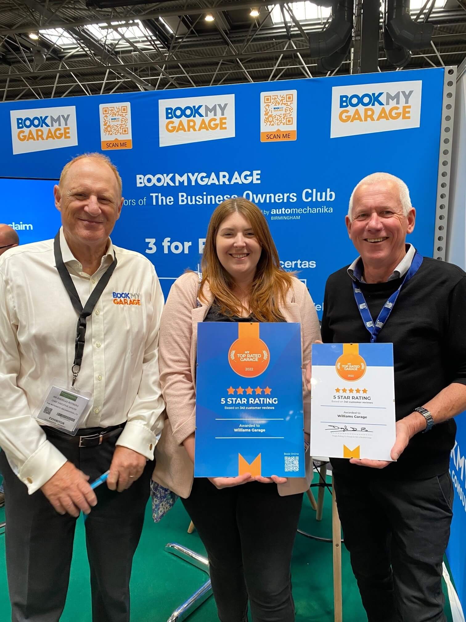 Williams Garage employees standing next to Douglas Rotberg, BookMyGarage CEO